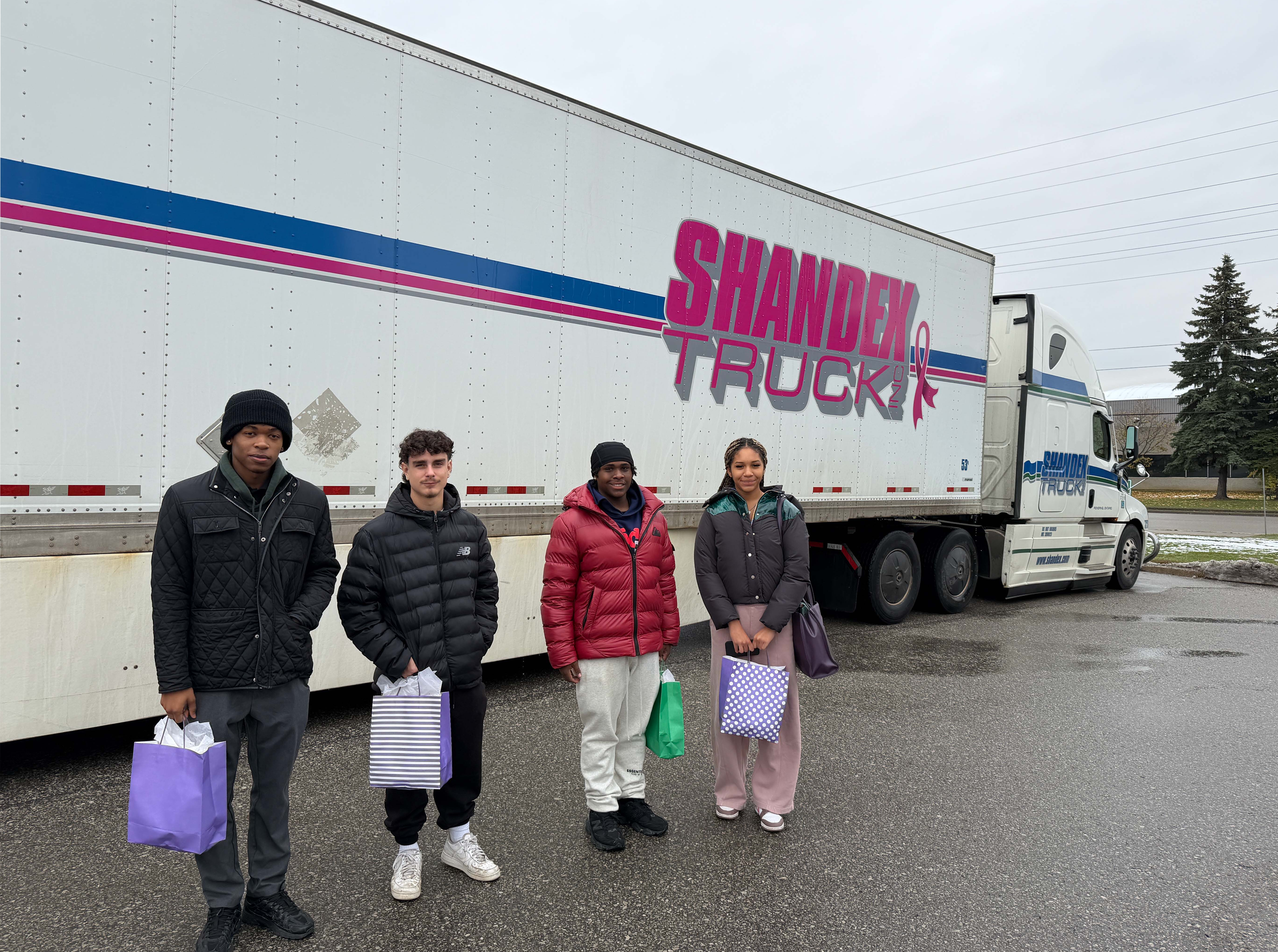 Students in front of a truck
