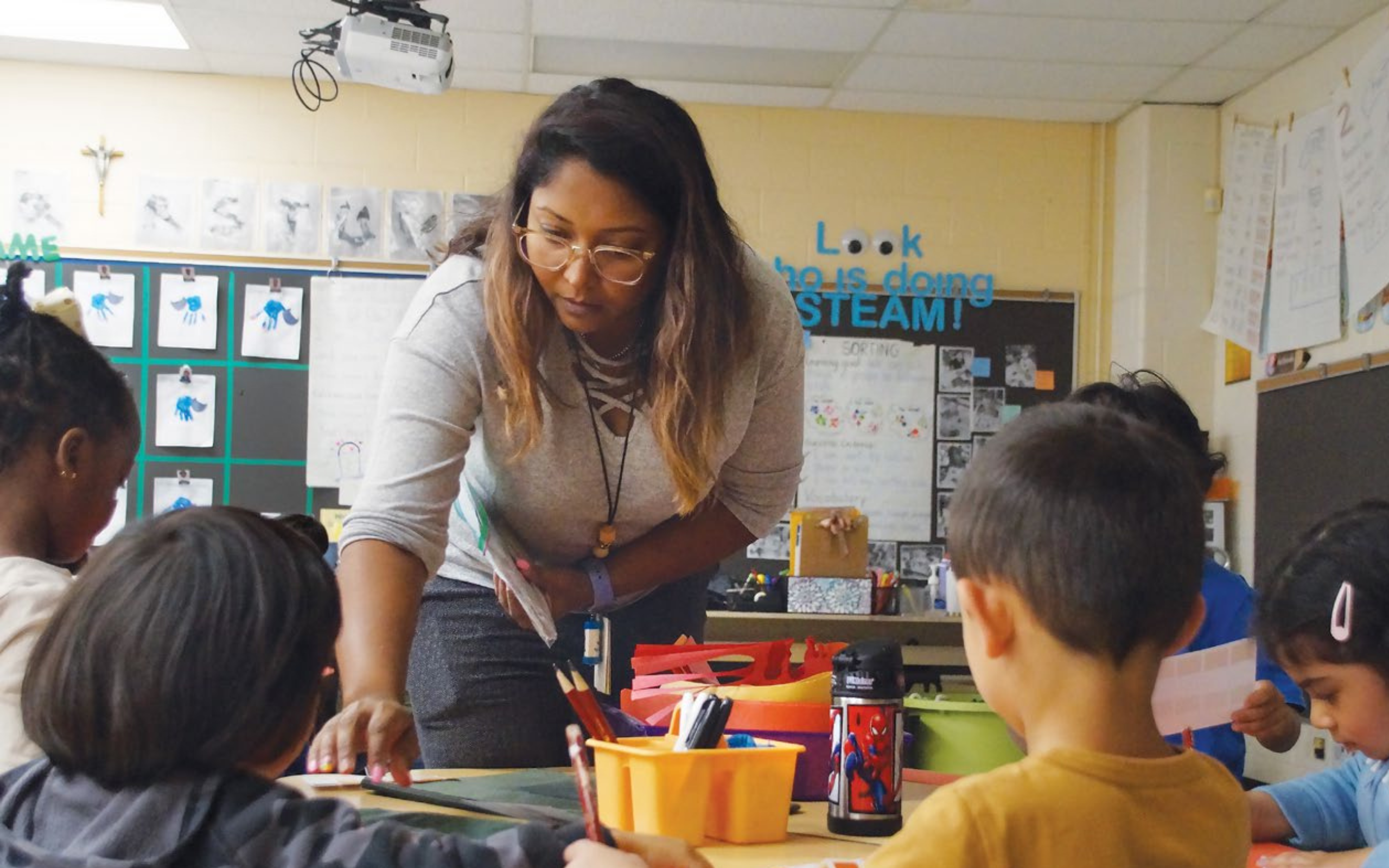 Teacher helping students